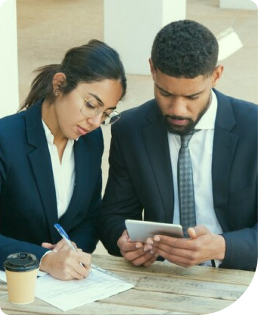 Loan officer advising a client at the Hazir Financial Services office in Islamabad